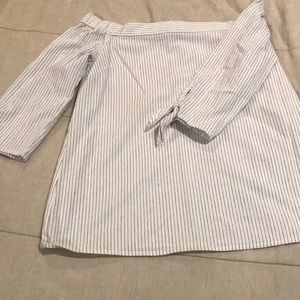 Off the shoulder striped shirt with tie sleeves.